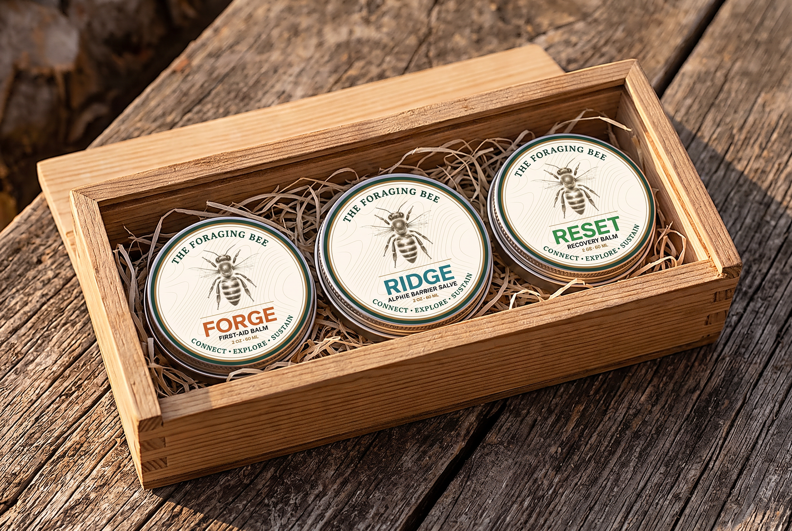 Reclaimed-wood gift box holding the RIDGE, FORGE and RESET salve tins on barn wood